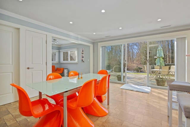 dining space featuring ornamental molding