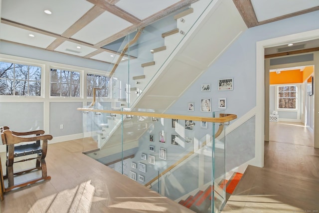 staircase with hardwood / wood-style floors