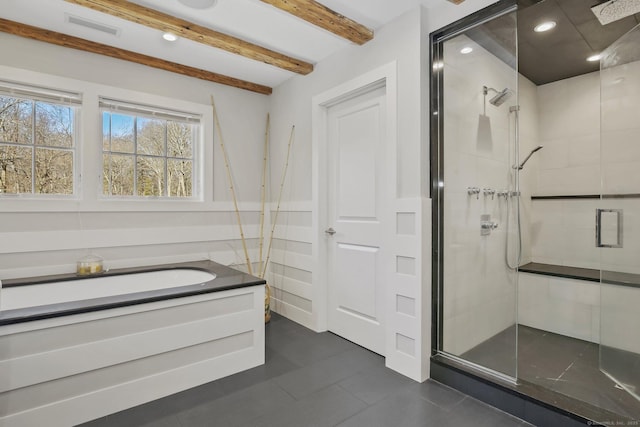 bathroom featuring beamed ceiling, separate shower and tub, and sink