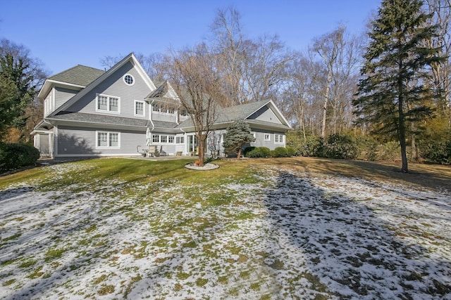 view of front of property with a yard and a patio area