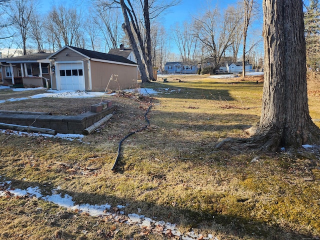 view of yard featuring a garage