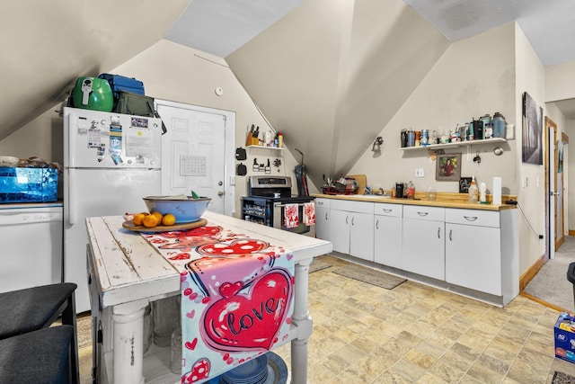 kitchen featuring white cabinetry, white appliances, and vaulted ceiling