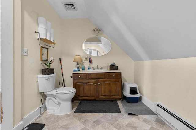 bathroom featuring baseboard heating, vanity, toilet, and vaulted ceiling