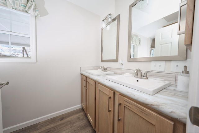 bathroom featuring vanity and wood-type flooring