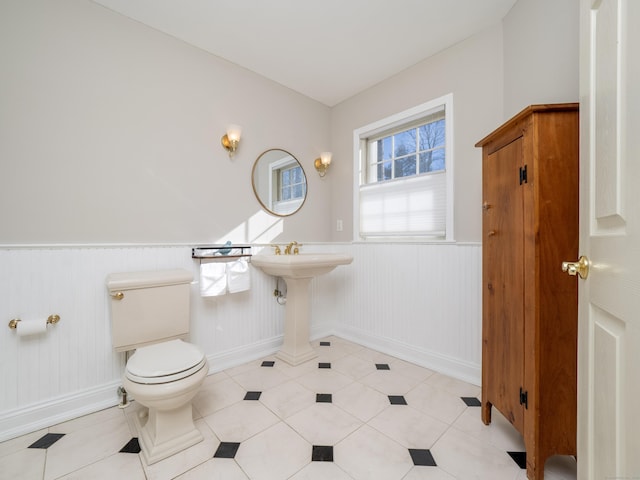 bathroom with tile patterned flooring and toilet