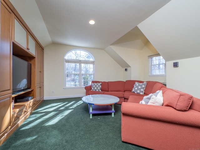 living room featuring lofted ceiling and dark colored carpet