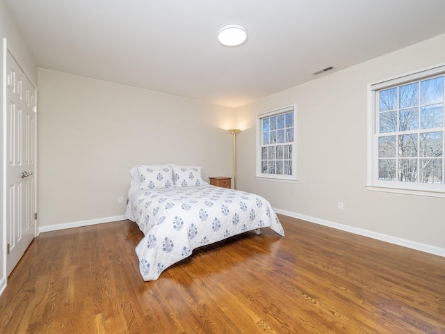 bedroom featuring dark hardwood / wood-style floors