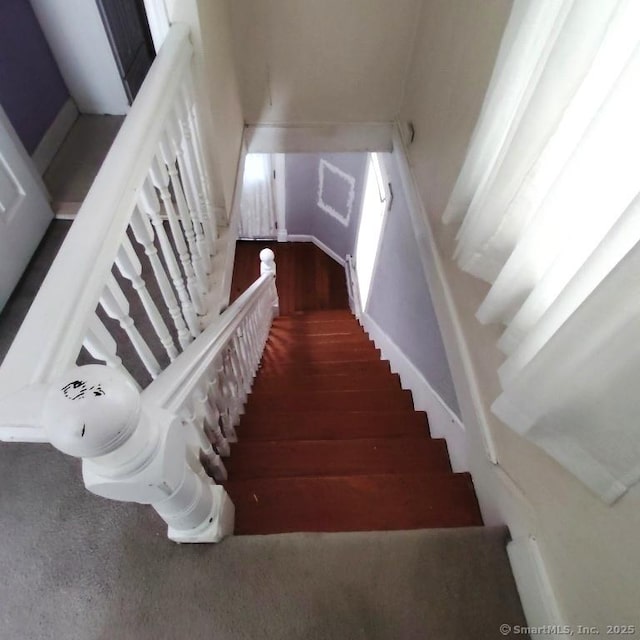 staircase featuring hardwood / wood-style flooring