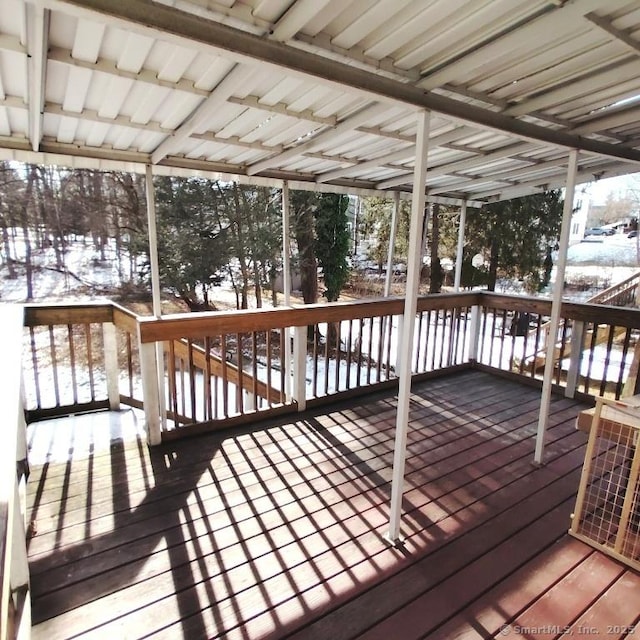 snow covered deck with central AC unit