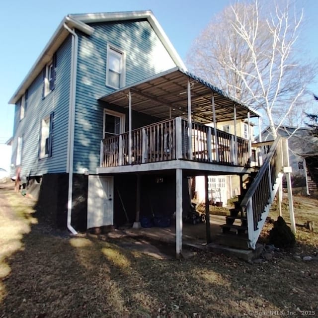 back of property with a deck