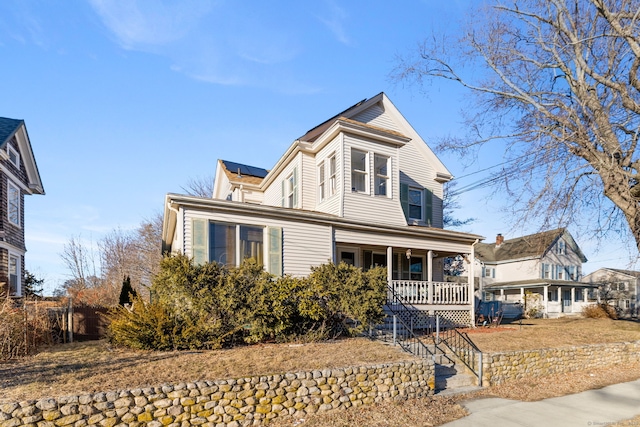 view of front property featuring covered porch