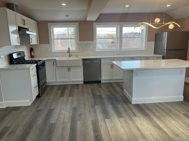 kitchen featuring sink, dishwasher, white cabinetry, hanging light fixtures, and gas stove