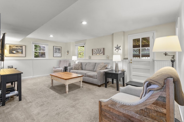 living room featuring a healthy amount of sunlight and light carpet