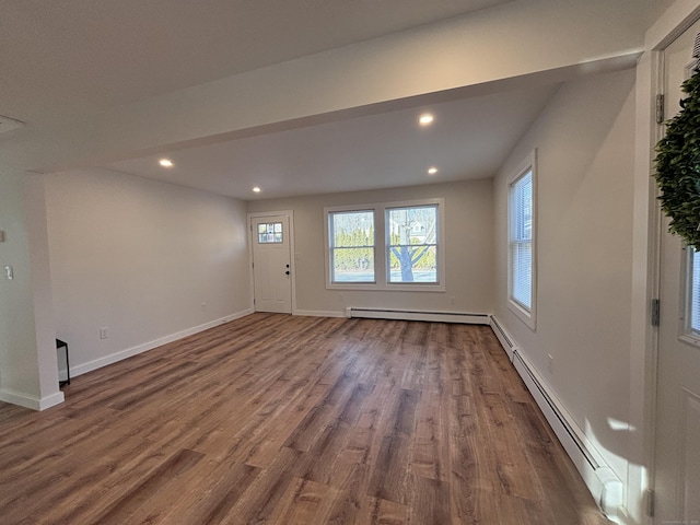 interior space with hardwood / wood-style floors and baseboard heating