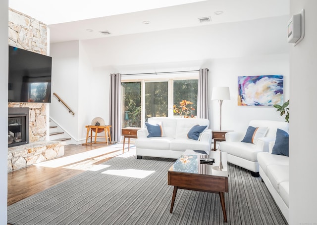 living room featuring a fireplace