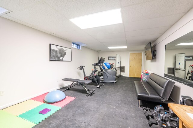 exercise area featuring a paneled ceiling