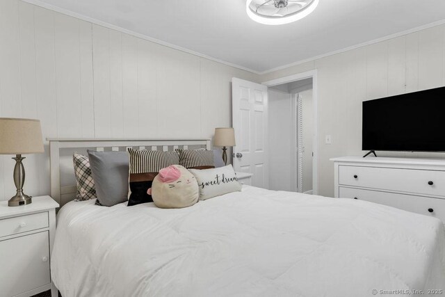 bedroom with ornamental molding