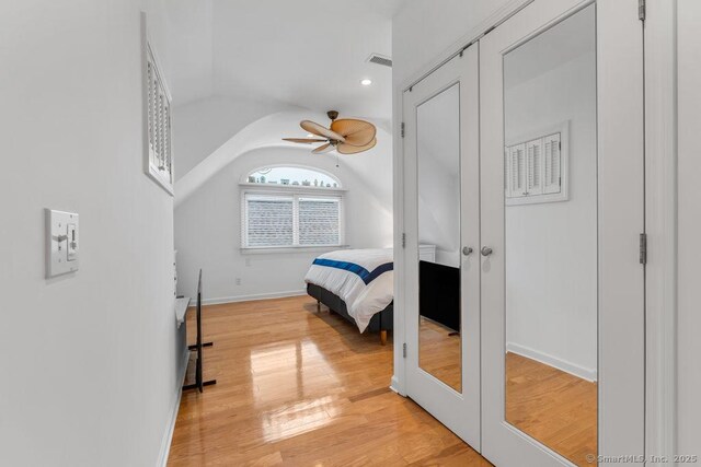 bedroom featuring vaulted ceiling and light hardwood / wood-style flooring