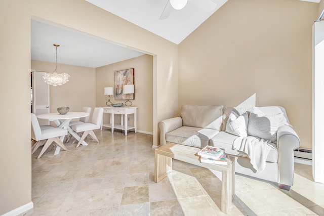 living room featuring ceiling fan with notable chandelier, a baseboard radiator, and vaulted ceiling