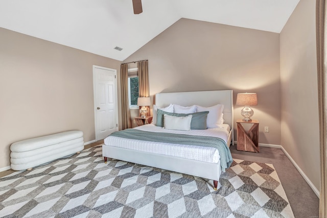 carpeted bedroom featuring lofted ceiling and ceiling fan