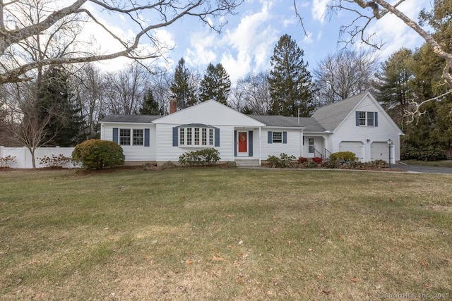 view of front of house with a garage and a front yard