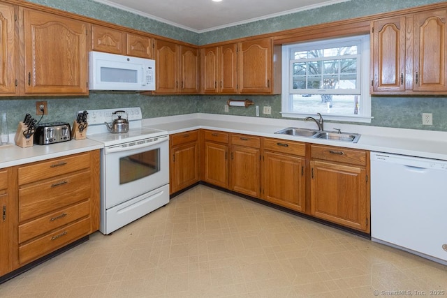 kitchen with crown molding, white appliances, sink, and tasteful backsplash