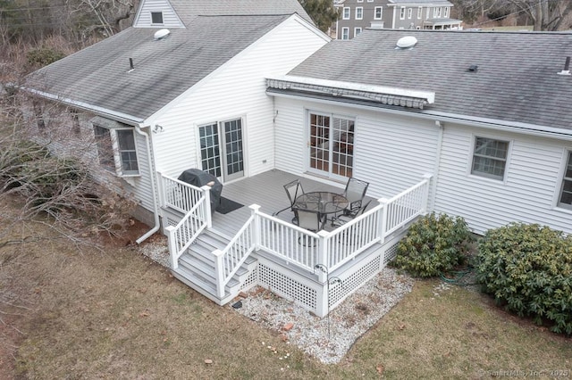 back of house with a lawn and a deck