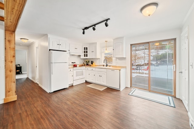 kitchen with pendant lighting, sink, white appliances, dark wood-type flooring, and white cabinets