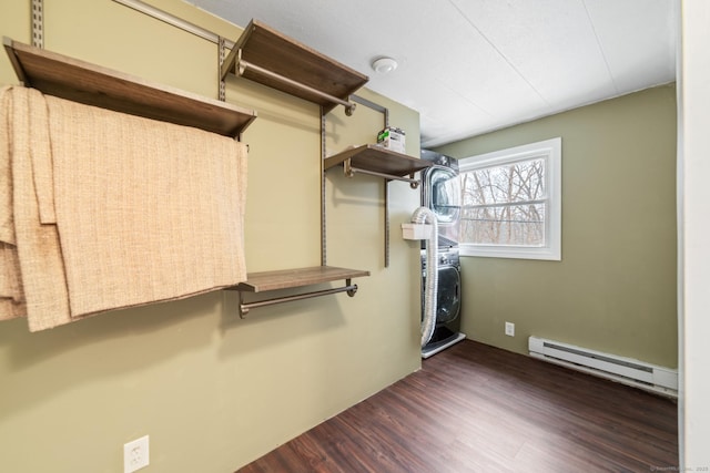 spacious closet featuring dark wood-type flooring and a baseboard radiator