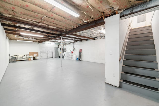 basement with independent washer and dryer and water heater