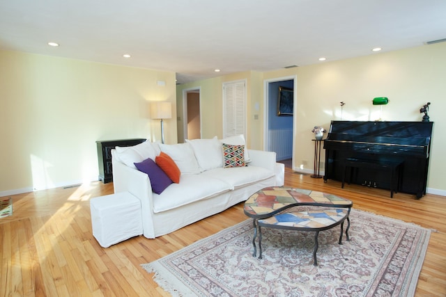 living room with light hardwood / wood-style flooring