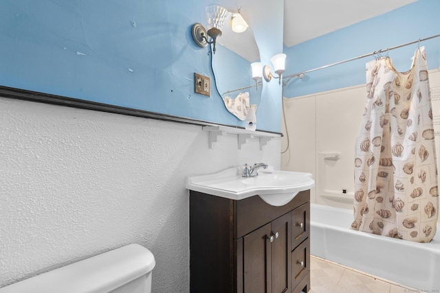 full bathroom featuring vanity, tile patterned flooring, shower / bath combo with shower curtain, and toilet