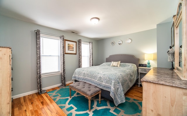 bedroom with hardwood / wood-style flooring