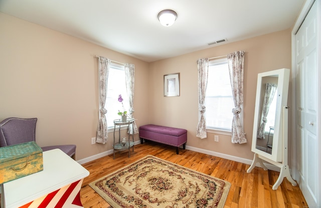 living area with hardwood / wood-style floors