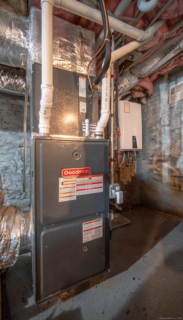 utility room with tankless water heater