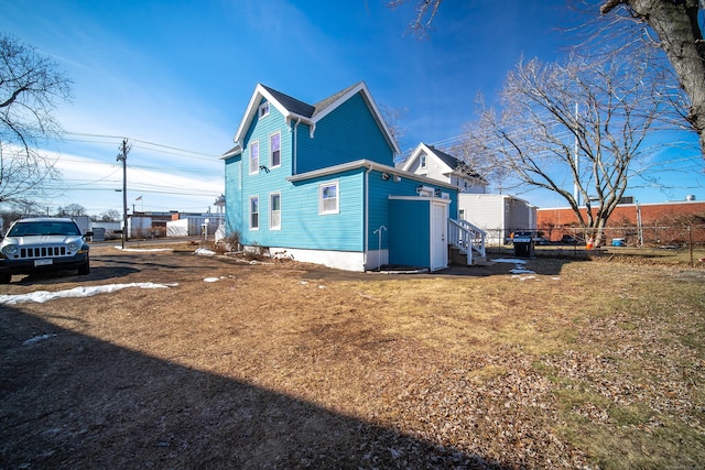 view of home's exterior with a yard