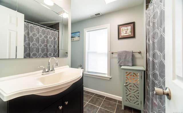 bathroom featuring tile patterned floors and vanity