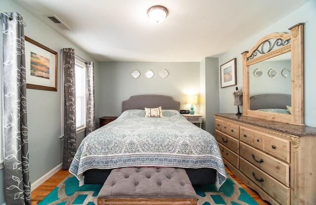 bedroom with wood-type flooring