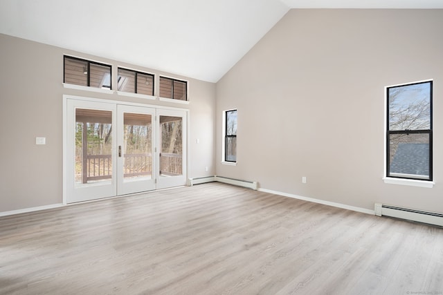 unfurnished room featuring baseboards, a baseboard radiator, high vaulted ceiling, light wood-style flooring, and a baseboard heating unit