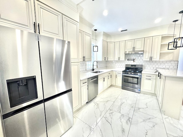 kitchen featuring stainless steel appliances, tasteful backsplash, sink, and pendant lighting