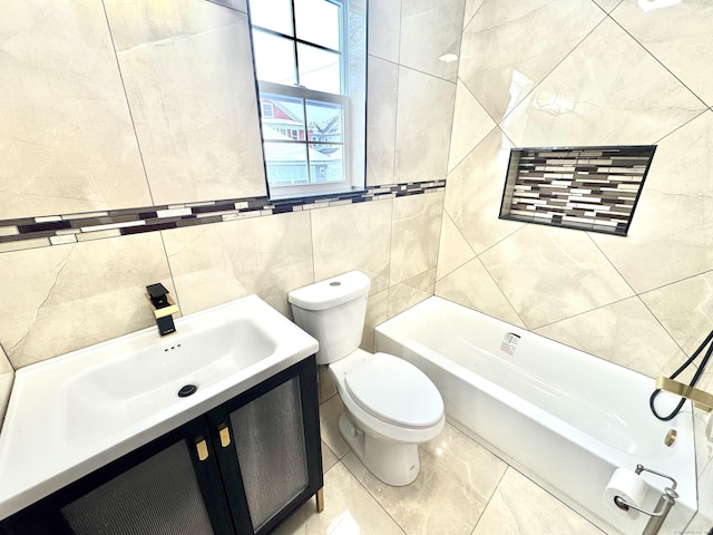 bathroom featuring vanity, tile walls, and toilet