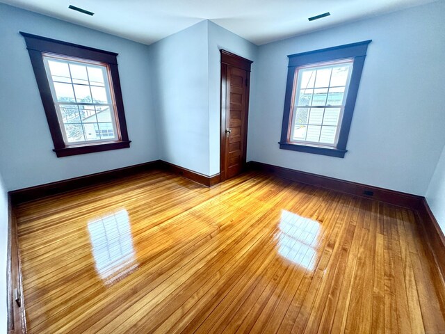 interior space featuring plenty of natural light and light hardwood / wood-style flooring