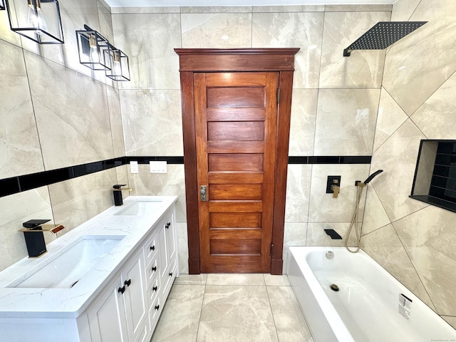 bathroom featuring vanity, tiled shower / bath combo, and tile walls