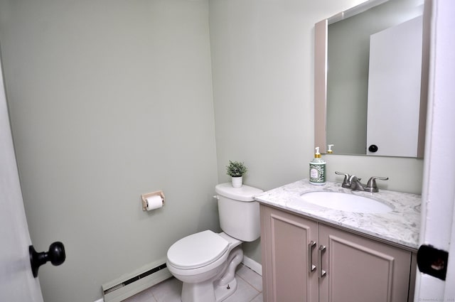 bathroom featuring tile patterned flooring, vanity, toilet, and baseboard heating