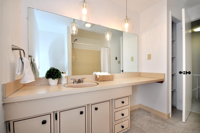 bathroom featuring vanity and a shower with curtain