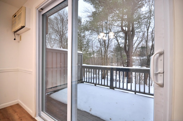 view of snow covered back of property