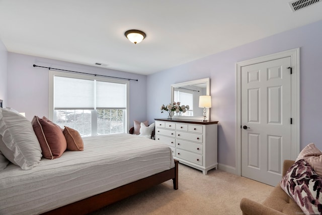 bedroom featuring light colored carpet