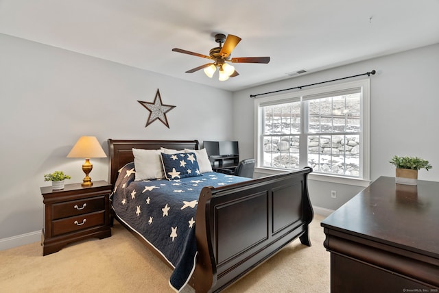 carpeted bedroom with ceiling fan