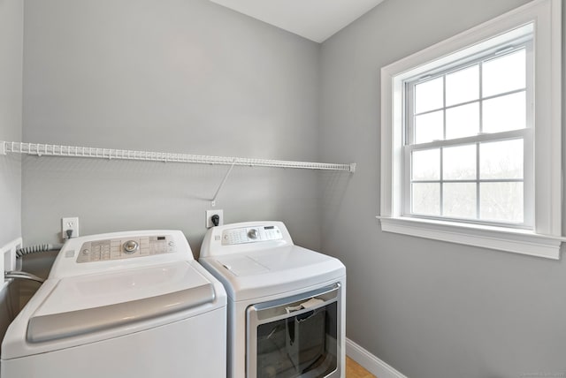 laundry room with independent washer and dryer