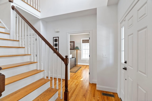 entryway with light hardwood / wood-style flooring